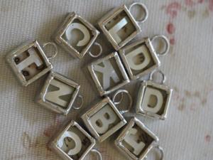 Tiny  Treasure Mother of pearl Initial L